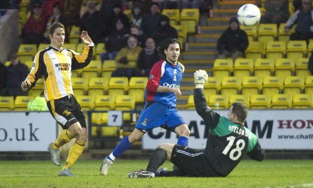 Juanjo tucks away a Caley Thistle goal in a 4-1 victory against Livingston in 2005. Image: SNS.