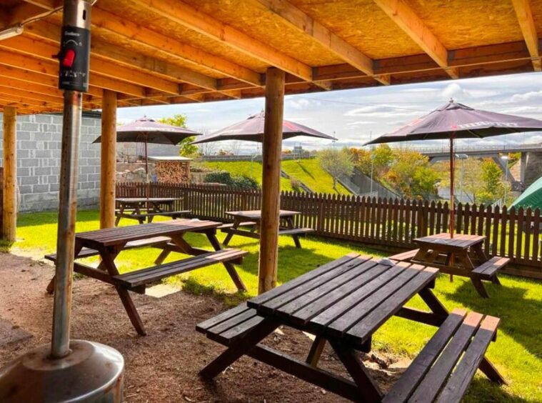 Picnic area overlooking the river with umbrella's.