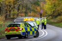 Police at the scene on the A98 near Fochabers. Image: Jasperimage.