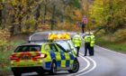 Police at the scene on the A98 near Fochabers. Image: Jasperimage.