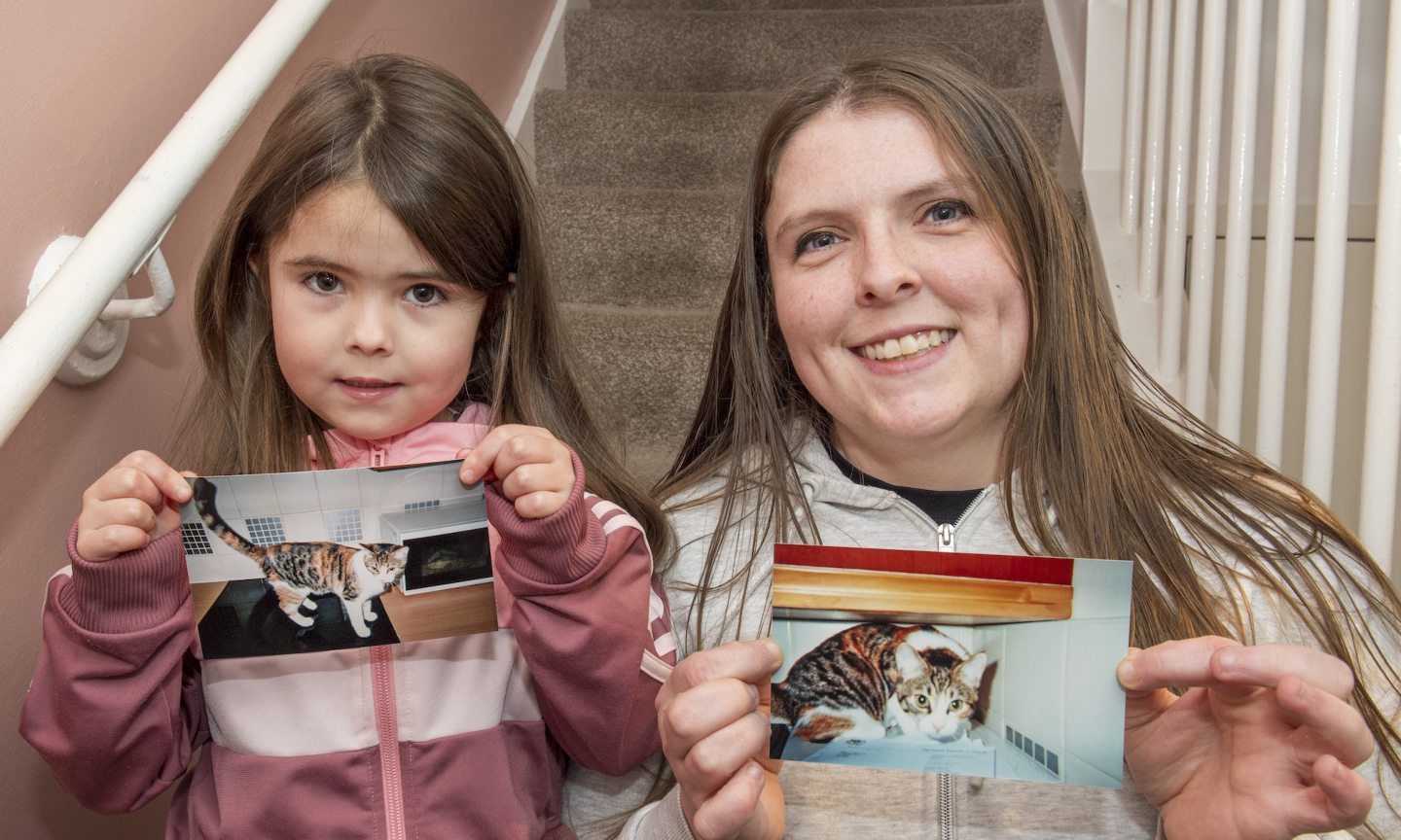 Susan Manson, pictured with her daughter Merran, holding pictures of Mona.