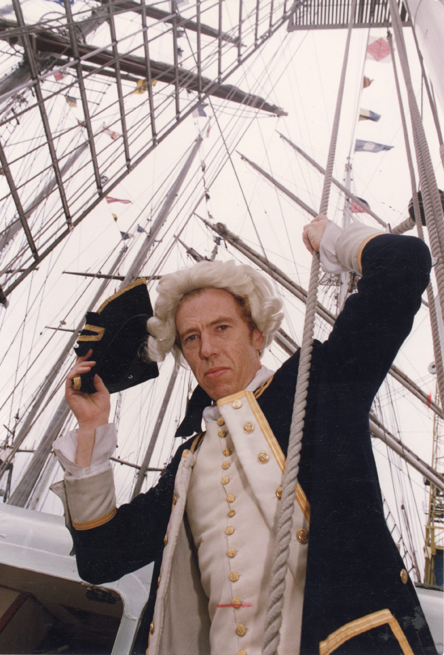 A man dressed in period clothing on a boat