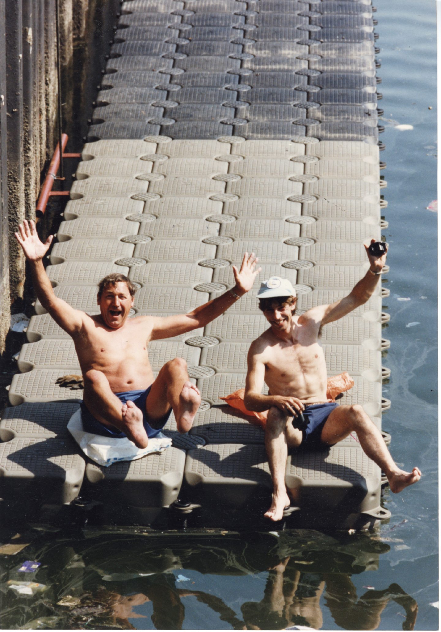 Two men on a floating pontoon