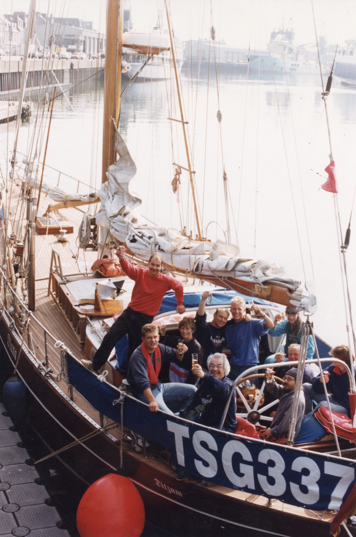 The crew of the German 58m sloop Diana celebrate as their craft berths in Aberdeen Harbour, the first from the Inverness leg of the Tall Ships Race to arrive.