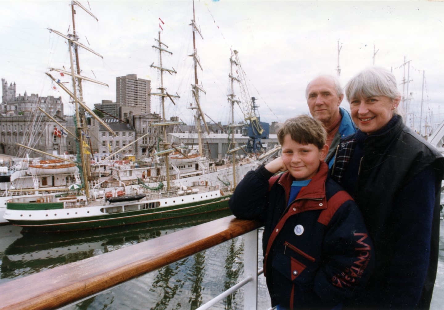 A family on board a boat awaiting the Tall Ships race