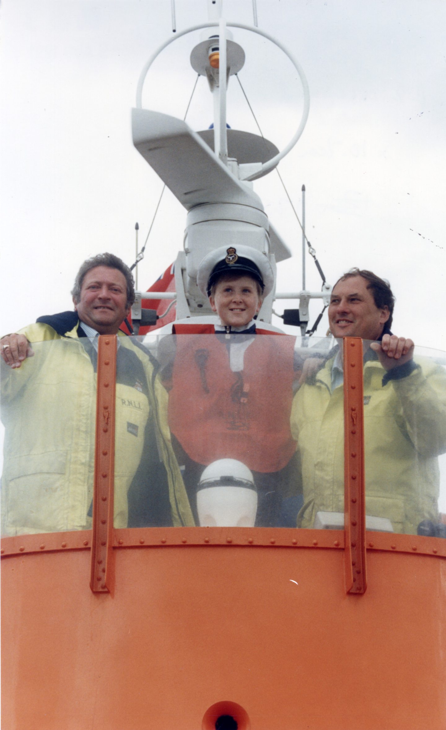 An Aberdeen boy with two crew members on a vessel