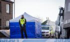 Location, Ives Road, Peterhead.
Scene of a suspected murder in Ives Road, Peterhead
Pictured is a police tent covering the scene
Monday, 6th, February 2023 
Image: Wullie Marr / DC Thomson