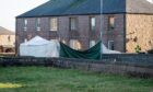 Location, Ives Road, Peterhead.
Scene of Andrew Ross' murder in Ives Road, Peterhead
Pictured is Police have a tent and sheets across the road to protect the scene
Monday, 6th, February 2023 
Image: Wullie Marr / DC Thomson