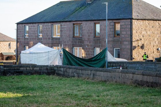 Location, Ives Road, Peterhead.
Scene of Andrew Ross' murder in Ives Road, Peterhead
Pictured is Police have a tent and sheets across the road to protect the scene
Monday, 6th, February 2023 
Image: Wullie Marr / DC Thomson