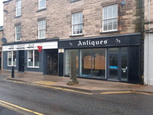 Plans revealed to give a new use to long-vacant former estate agent and antique shop