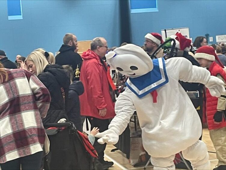 Members of Highland Cosplays attend the market.