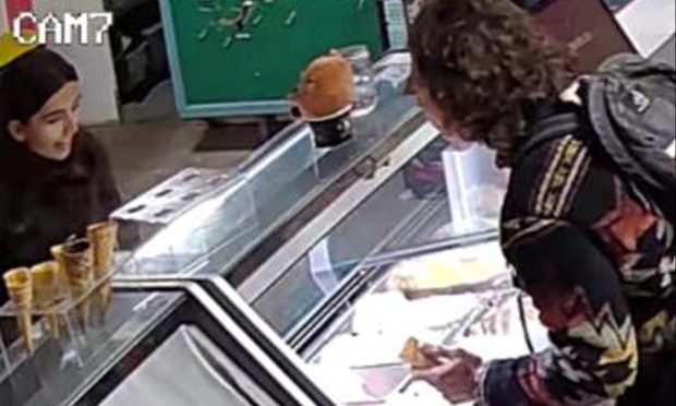 The pair laughed over the counter as they helped themselves to ice cream. Image: Supplied.