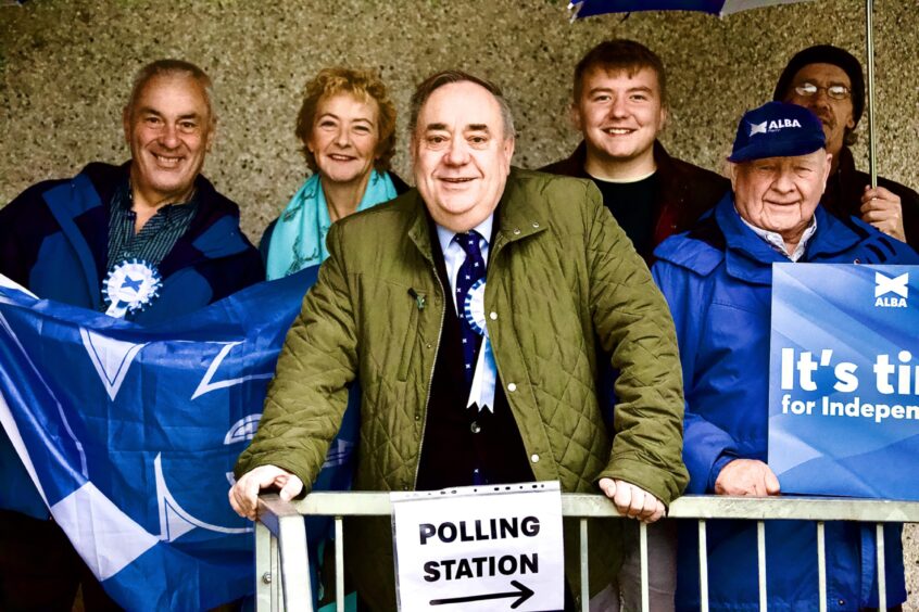 Alex Salmond and Alba Party activists at his local Strichen polling station