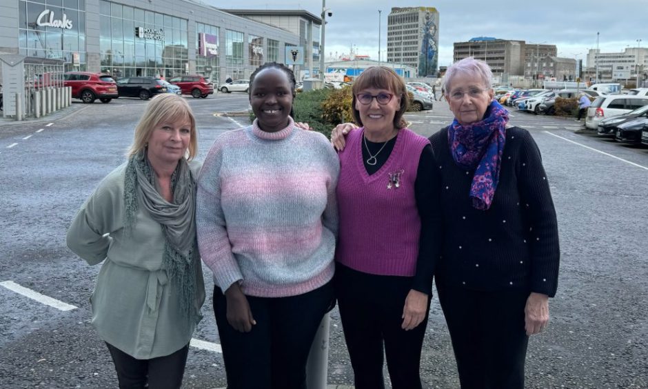 Beatrice Tumusiime and Marlyn Somers, centre right, with Uganda Aid Person to Person team members Lisa Ruxton, left and Rosemary Warde, right, in Aberdeen.