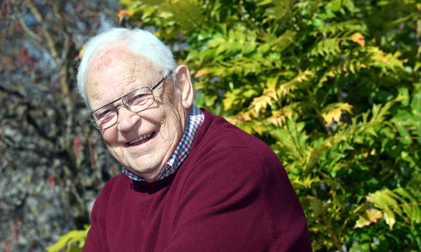 Jim McColl dressed in a wine coloured jumper