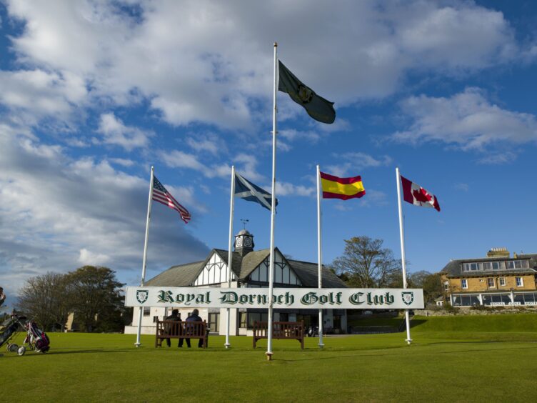 Royal Dornoch Golf Club with the flags and sign.