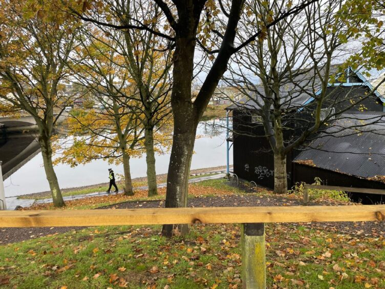 Police can be seen working in the area of Aberdeen Rowing Club. 