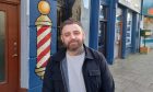 Mark Andrew at the traditional barber shop in Oban