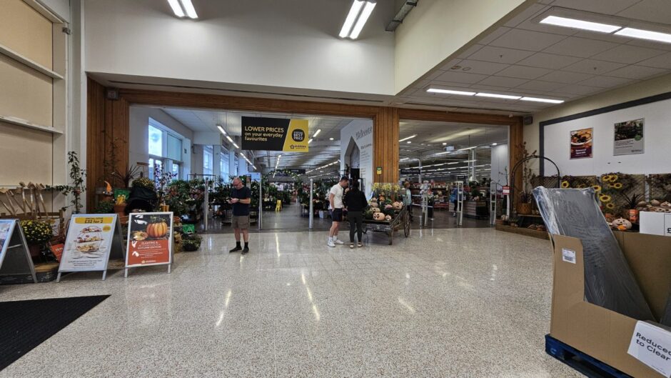 View of Dobbies Inverness entrance from inside Tesco Extra store.