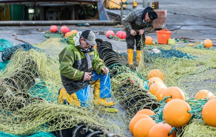 Fishers working on their nets in Peterhead. Peterhead