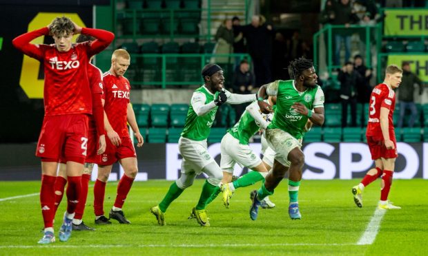 Rocky Bushiri of Hibernian celebrates after scoring a last-minute equaliser to make it 3-3 against Aberdeen at Easter Road. Image: Shutterstock.