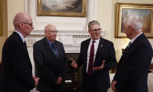 Prime Minister Sir Keir Starmer, centre right, and Chancellor of the Duchy of Lancaster Pat McFadden, left, with Elizabeth Emblem campaigners Bryn Hughes, right, and Paul Bone