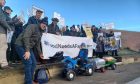 Five-year-old Blair Campbell, on his tractor, with his dad, Scott. and the rest of the north-east contingent in Edinburgh..