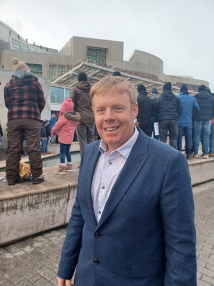 Tim Eagle MSP outside Holyrood