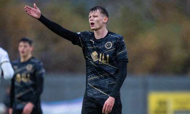 Inverness Caledonian Thistle midfielder Adam Mackinnon points towards team-mates in their 3-1 League One defeat at Dumbarton on Octobet 26, 2024.