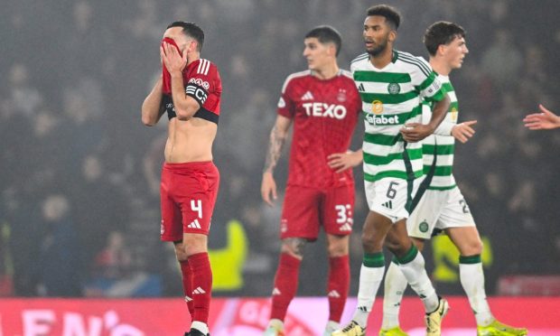 Aberdeen's Graeme Shinnie looks dejected during the heavy League Cup semi-final loss to Celtic. Image: SNS