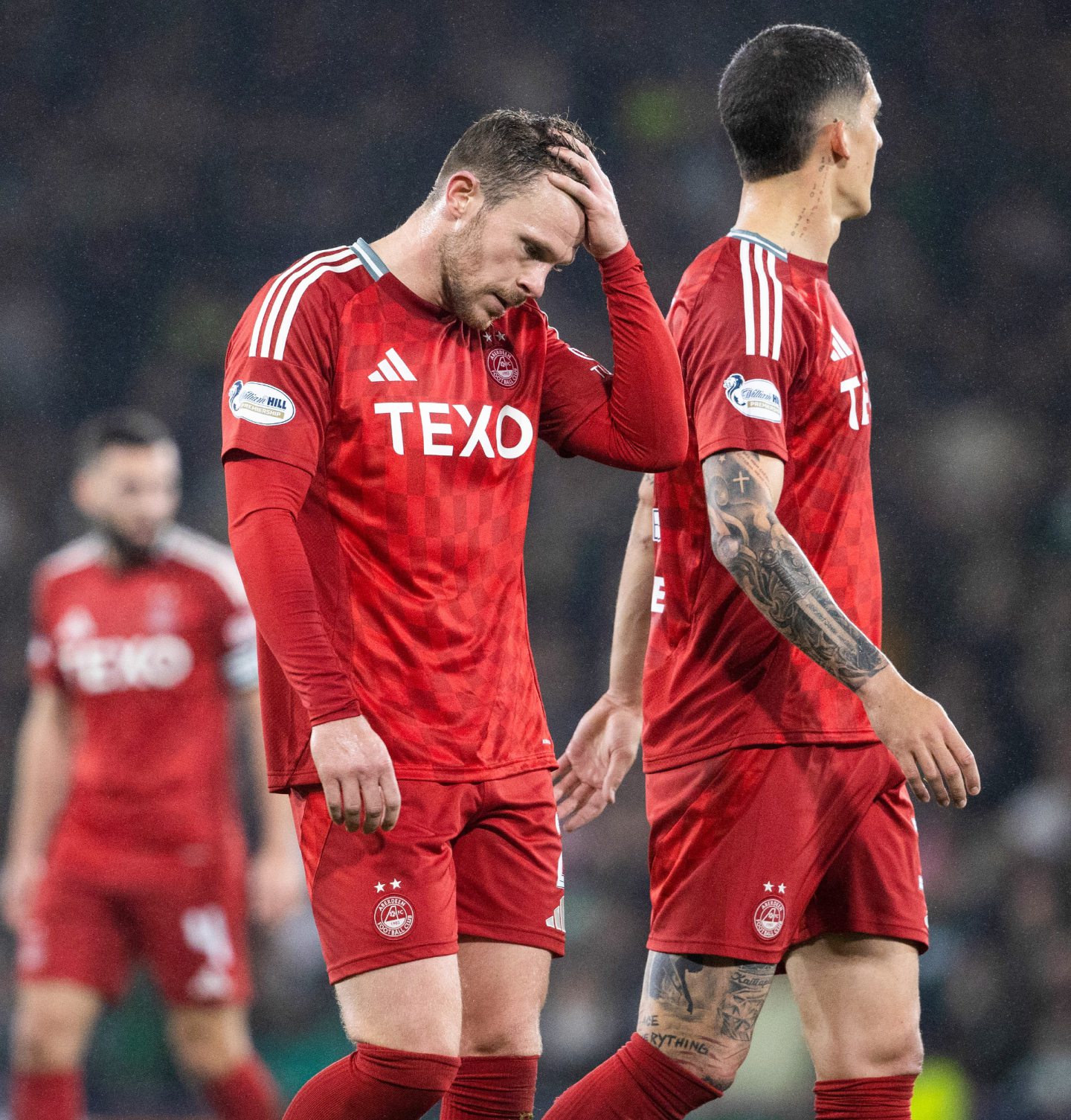 Aberdeen's Nicky Devlin looks dejected during the 6-0 League Cup semi-final loss to Celtic. Image: SNS 