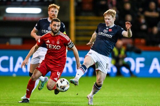 Dundee's Lyall Cameron (R) and Aberdeen's Graeme Shinnie in action in a Premiership match at Pittodrie. Image: SNS