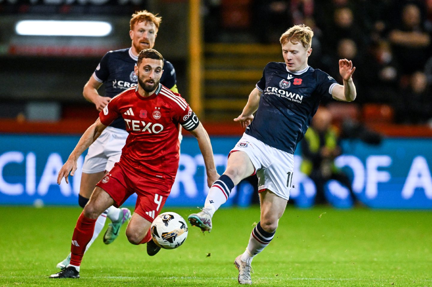 Dundee's Lyall Cameron (R) and Aberdeen's Graeme Shinnie in action in a Premiership match at Pittodrie. Image: SNS 