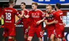 Aberdeen's Topi Keskinen (centre right) celebrates scoring to make it 2-0 against Dundee. Image: SNS.