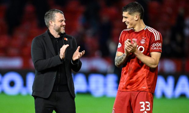 Aberdeen manager Jimmy Thelin (L) and Slobodan Rubezic at full time following the 4-1 win against Dundee. Image: SNS