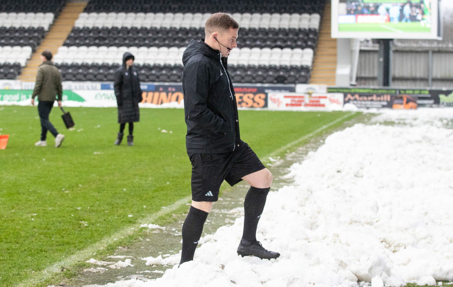 Referee John Beaton inspects the pitch ahead of the St Mirren v Aberdeen clash. Image: SNS 