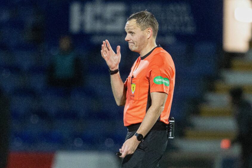 Referee Chris Graham during a lengthy VAR check before Motherwell's Zach Robinson's goal stood.