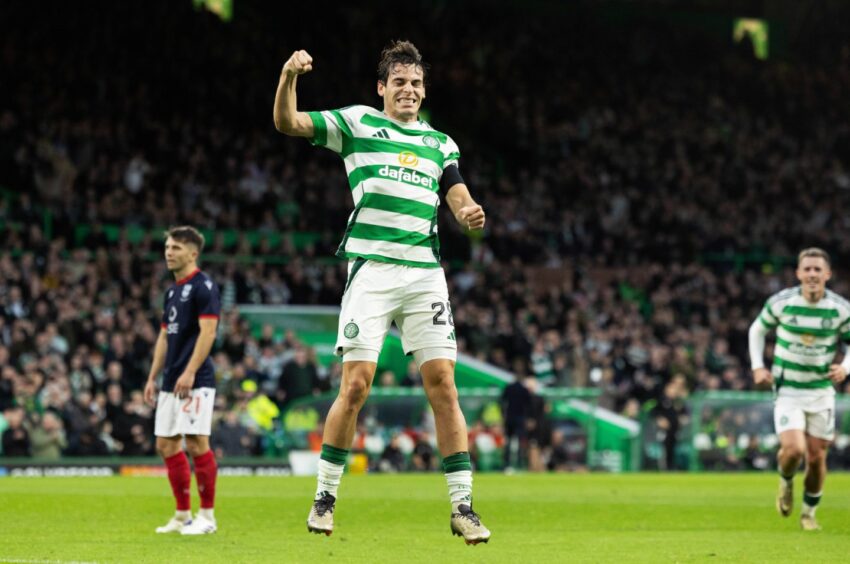 Celtic's Paulo Bernardo leaps into the air to celebrate after scoring to make it 3-0 against Ross County in the Premiership match which finished 5-0 to Celtic on November 30, 2024. 