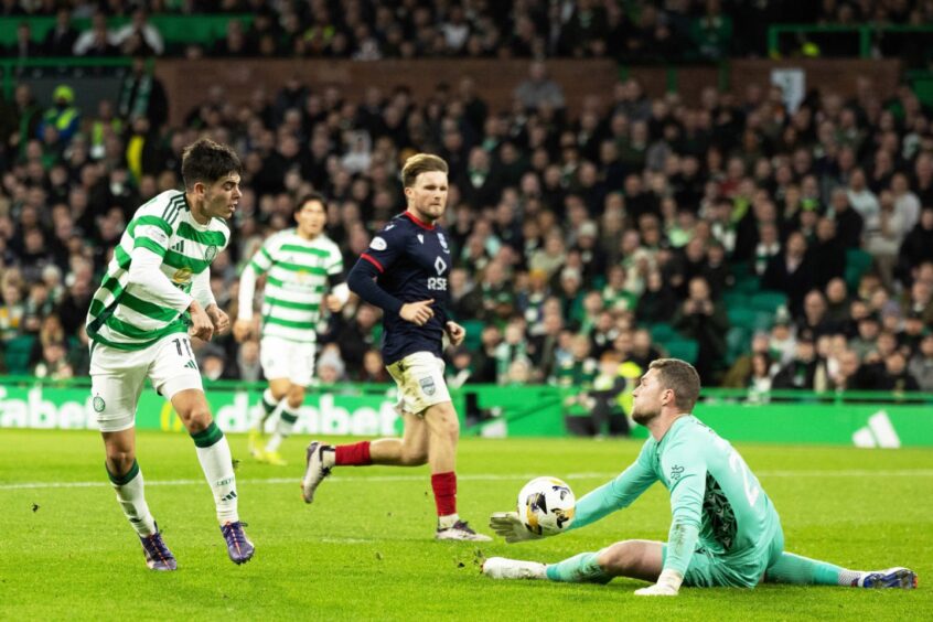 Ross County goalkeeper Jack Hamilton saves from Celtic's Alex Valle during the Hoops' 5-0 win in the Premiership on Saturday, November 30, 2024. Hamilton replaced injured County number one Ross Laidlaw just before half-time with the scoreline already at 5-0. 