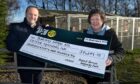 Press & Journal Editor, Craig Walker presents a cheque for over £15,000 to Iona Nicol of the Munlochy Animal Aid charity, based at Munlochy on the Black Isle, as part of our 275 P&J Community Fund.
Image: Sandy McCook/DC Thomson