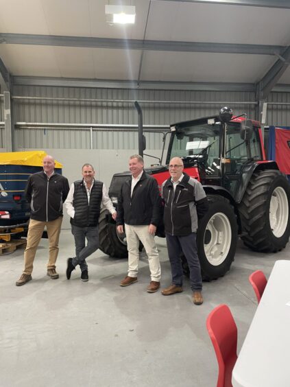 Ali, second from the left, with  Agco team members he has worked with for decades. 