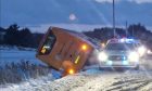 Stagecoach bus on its side on the A952. Image: Peterhead Live.