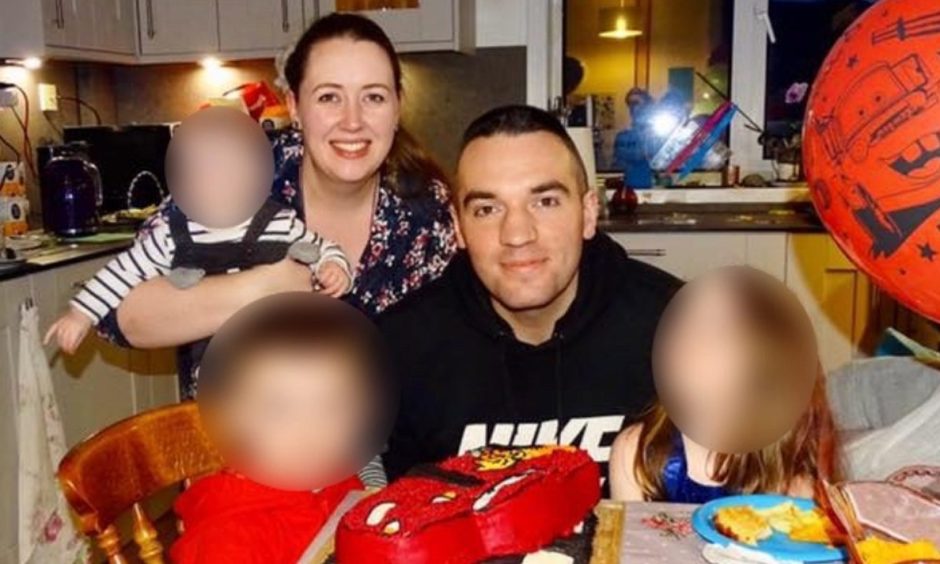 Finlay MacDonald with three of his four children in the kitchen where he knifed his wife Rowena. Image: Facebook