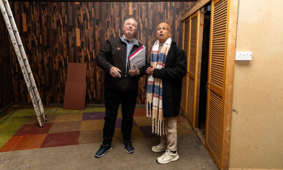 Image shows viewing agent George Sharp and Masood Hussain inside Aladdin's Cave, Aberdeen.