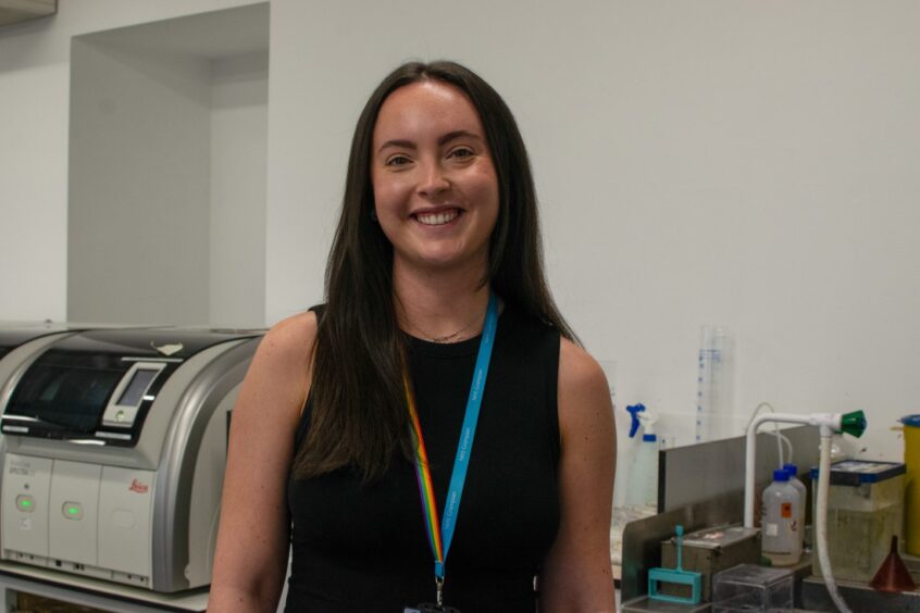 Merran King smiling at the camera inside a laboratory in Aberdeen Royal Infirmary 