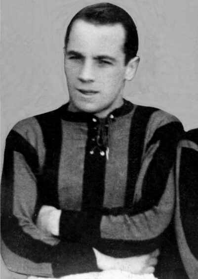 Prolific former Aberdeen FC Benny Yorston with his arms folded as he sits for a team photograph