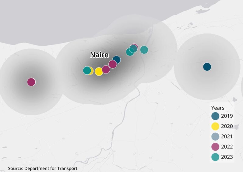 A close-up of collision blackspots in Nairn with crashes indicated with smaller coloured points.
