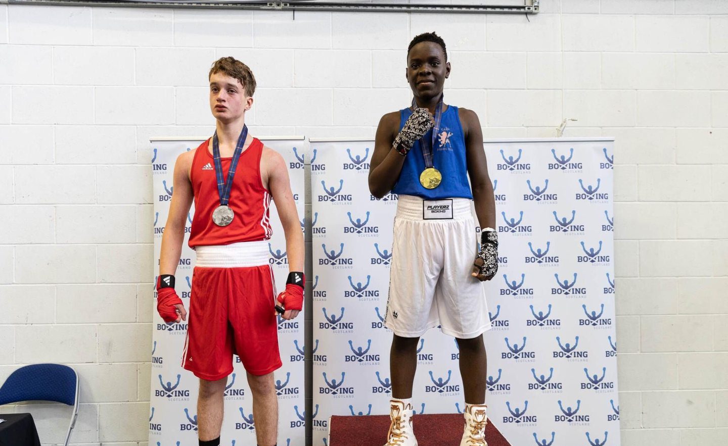 Jenome Adamu (right) of CAIN Boxing Club wins gold at the Scottish Development Championships. Image by Vera Cloe Zebrowska 