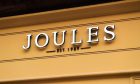 Joules sign with a yellow backgroun.