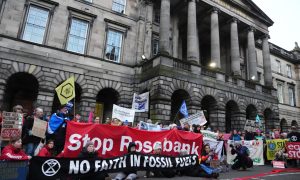 Climate activists from Greenpeace and Uplift during a demonstration outside the Scottish Court of Session today. Image: Andrew Milligan/PA Wire